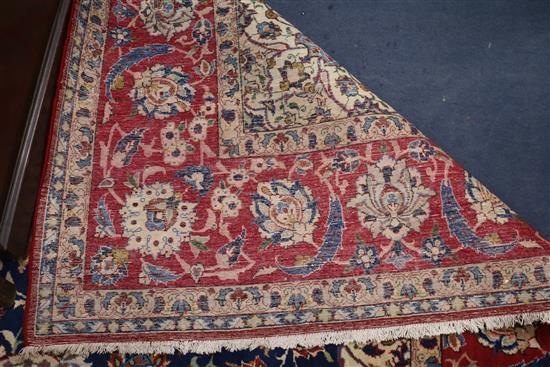 An Isfahan ivory ground carpet 340 x 235cm